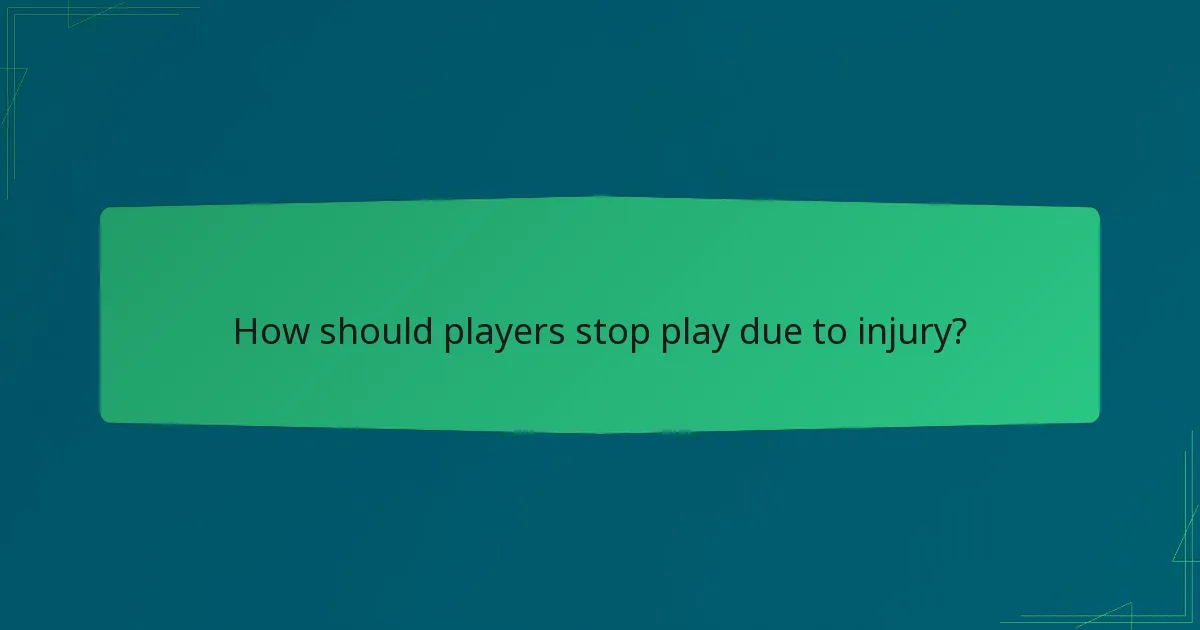 How should players stop play due to injury?